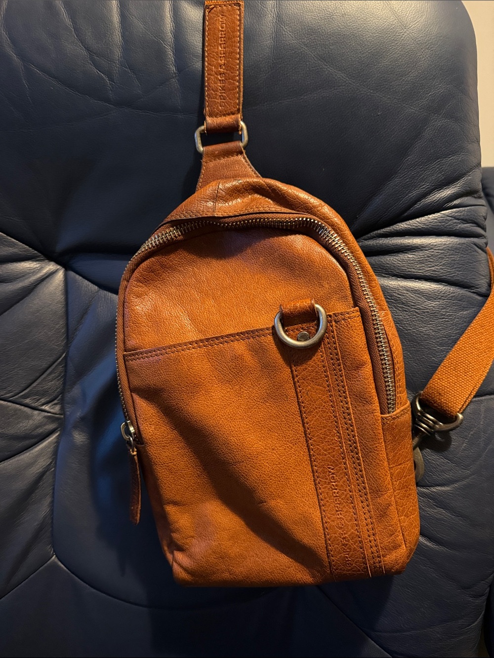 Beautiful Spikes and Sparrow cognac leather Bronco sling bag
